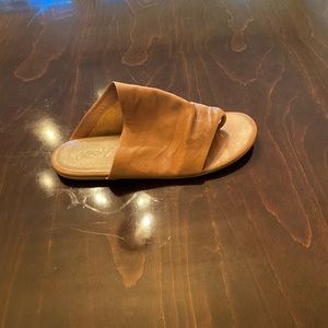 A pair of Marsell slides, flat in tan color.